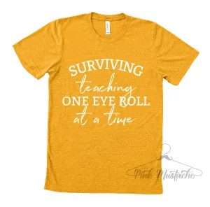 Surviving Teaching One Eye Roll At A Time / Teacher Life Tees / Teacher Shirts